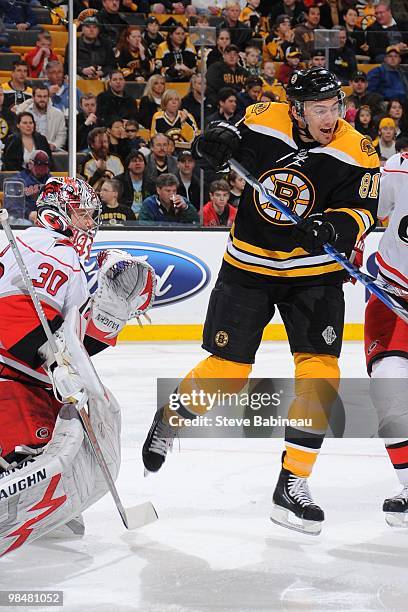 Miroslav Satan of the Boston Bruins makes a screen against Cam Ward of the Carolina Hurricanes at the TD Garden on April 10, 2010 in Boston,...