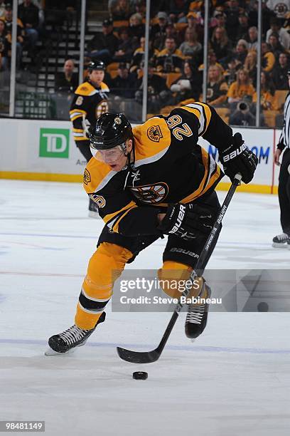 Blake Wheeler of the Boston Bruins skates up ice with the puck against the Carolina Hurricanes at the TD Garden on April 10, 2010 in Boston,...