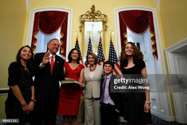 Rep. Ted Deutch poses for photographers with his wife Jill , twin daughters Gabrielle and Serena , his son Cole and Speaker of the House Rep. Nancy...