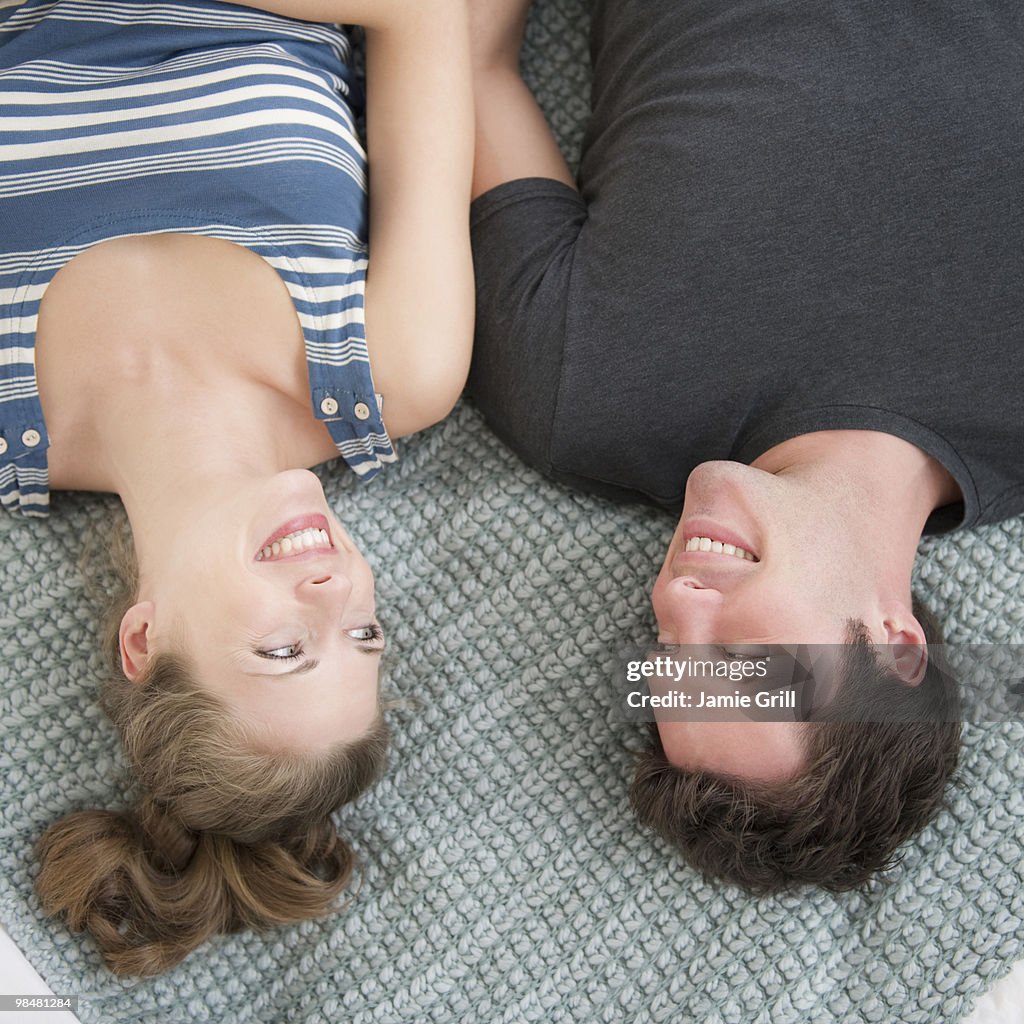 Couple lying on blanket together