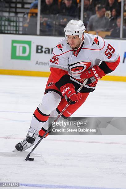 Chad LaRose of the Carolina Hurricanes skates up ice with the puck during the game against the Boston Bruins at the TD Garden on April 10, 2010 in...