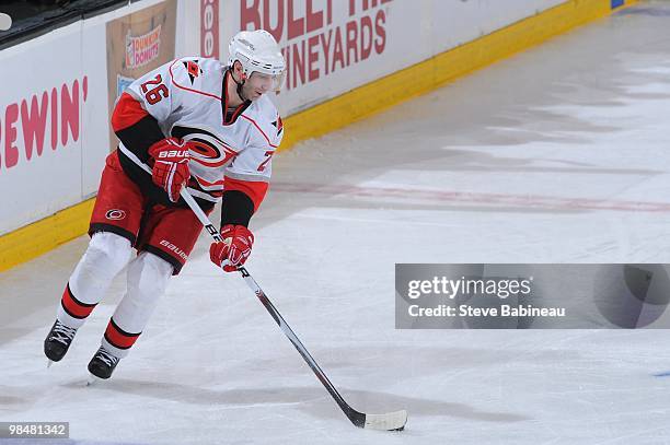 Erik Cole of the Carolina Hurricanes skates up ice with the puck against the Boston Bruins at the TD Garden on April 10, 2010 in Boston,...