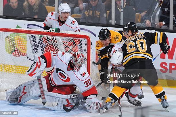 Cam Ward of the Carolina Hurricanes makes a save against Vladimir Sabotka of the Boston Bruins at the TD Garden on April 10, 2010 in Boston,...