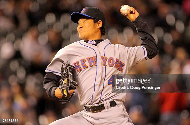 Relief pitcher Hisanori Takahashi of the New York Mets delivers against the Colorado Rockies during Major League Baseball action at Coors Field on...