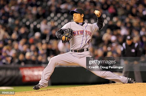 Relief pitcher Hisanori Takahashi of the New York Mets delivers against the Colorado Rockies during Major League Baseball action at Coors Field on...