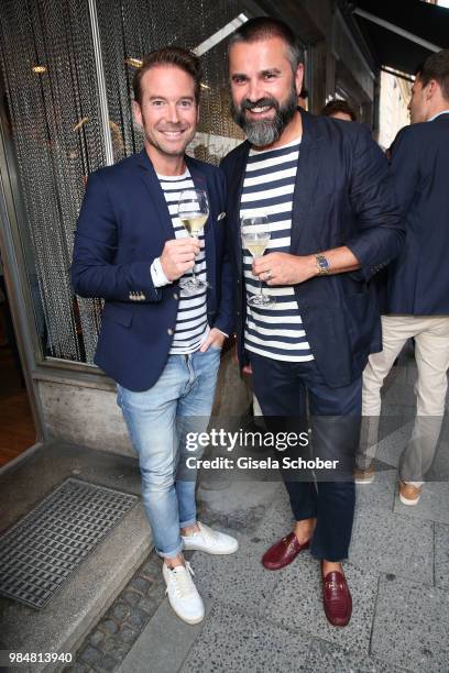 Sebastian Hoeffner, Andreas Haumesser during the opening of the first "Krug Fischmarkt" pop up fish restaurant on June 26, 2018 in Munich, Germany.