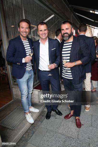 Sebastian Hoeffner, Jens Ciliax and Andreas Haumesser during the opening of the first "Krug Fischmarkt" pop up fish restaurant on June 26, 2018 in...