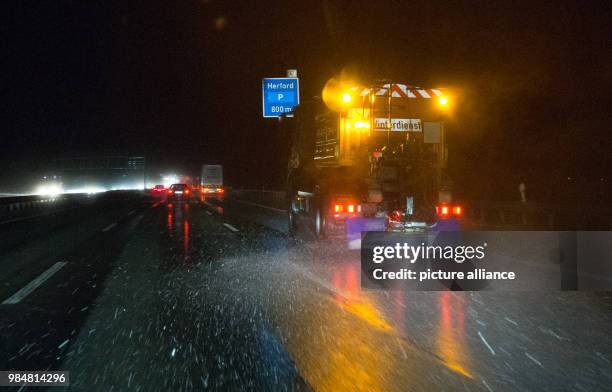 Vehicle of the winter road maintenance spreads salt along the freeway A" near Herford, Germany, 17 January 2018. The hurricane 'Friederike' moves...