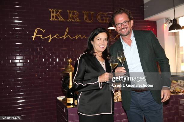 Margareth Henriquez, CEO of Krug and Jens Gardthausen, General Manager Moet Hennessy Germany during the opening of the first "Krug Fischmarkt" pop up...