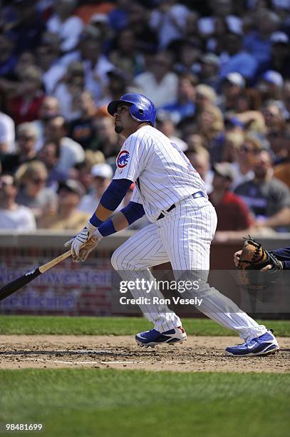 Geovany Soto of the Chicago Cubs hits a home run against the Milwaukee Brewers on April 14, 2010 at Wrigley Field in Chicago, Illinois. The Cubs...