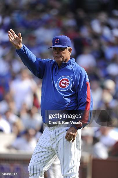 Manager Lou Piniella of the Chicago Cubs signals to the bullpen during the game against the Milwaukee Brewers on April 14, 2010 at Wrigley Field in...