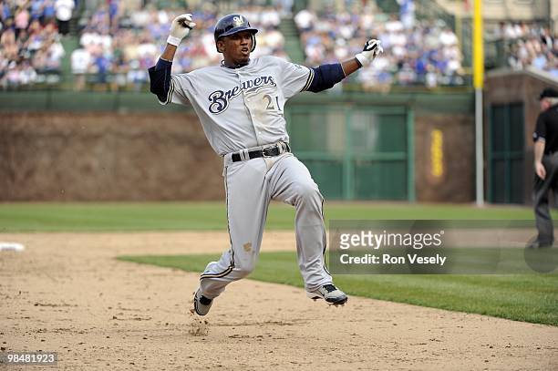 Alcides Escobar of the Milwaukee Brewers slides into third base after hitting a triple against the Chicago Cubs on April 14, 2010 at Wrigley Field in...