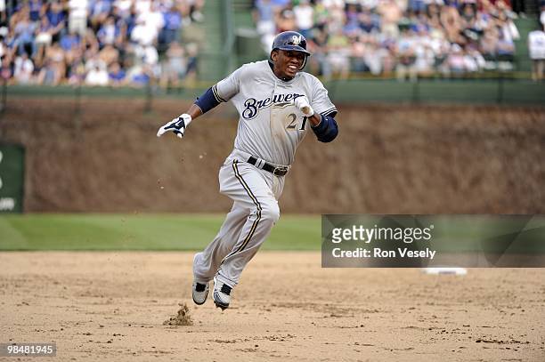 Alcides Escobar of the Milwaukee Brewers slides into third base after hitting a triple against the Chicago Cubs on April 14, 2010 at Wrigley Field in...