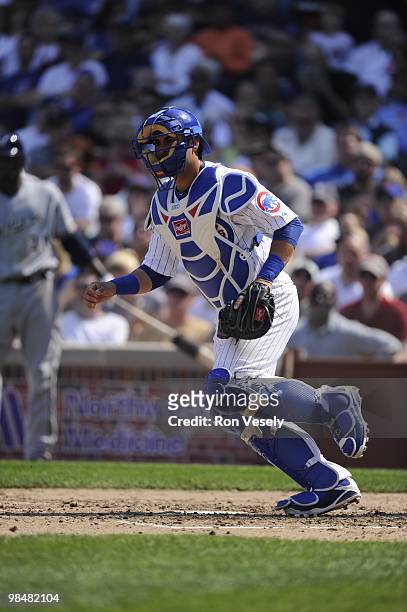 Geovany Soto of the Chicago Cubs catches against the Milwaukee Brewers on April 14, 2010 at Wrigley Field in Chicago, Illinois. The Cubs defeated the...