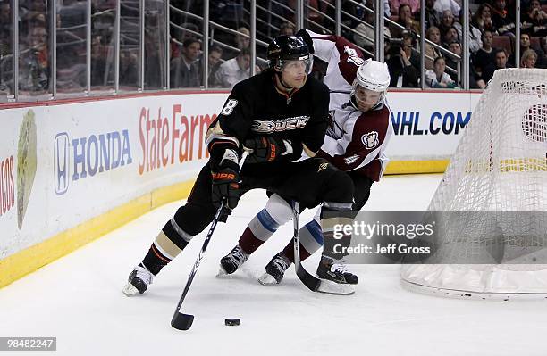 Teemu Selanne of the Anaheim Ducks fends off John-Michael Liles of the Colorado Avalanche in the third period at the Honda Center on March 3, 2010 in...