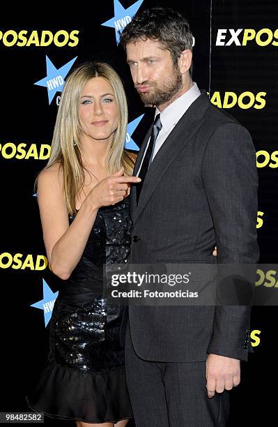 Actress Jennifer Aniston and actor Gerard Butler attend the premiere of "The Bounty Hunter" at Callao Cinema on March 30, 2010 in Madrid, Spain.