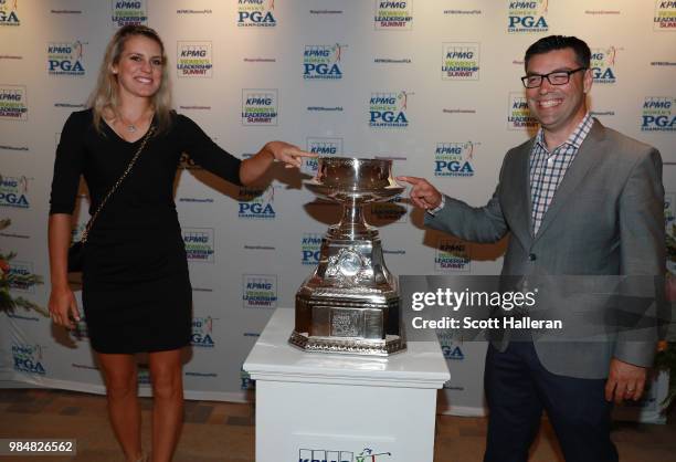 Player Olafia Kristinsdottir poses with Shawn Quill of KPMG at the KPMG Women's PGA Championship Welcome Reception at the Chicago Botanic Garden on...