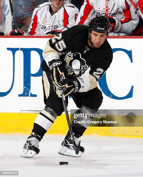 Maxime Talbot of the Pittsburgh Penguins makes a pass against the Washington Capitals on April 6, 2010 at the Mellon Arena in Pittsburgh,...