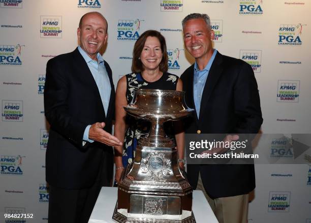 Rob Arning, Lynne Doughtie and Chris Goodman of KPMG pose together at the KPMG Women's PGA Championship Welcome Reception at the Chicago Botanic...