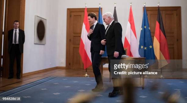 German president Frank-Walter Steinmeier and Austrian chancellor Sebastian Kurz leave the room after Kurz signed the golden book at Bellevue Palace...