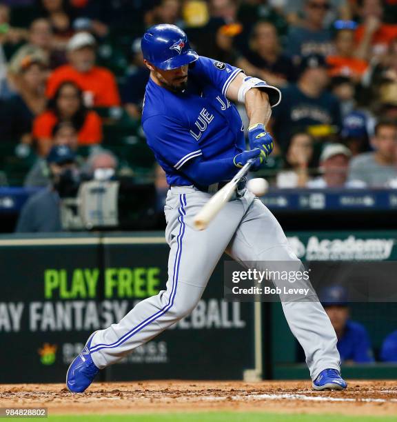 Randal Grichuk of the Toronto Blue Jays singles in the fifth inning against the Houston Astros at Minute Maid Park on June 26, 2018 in Houston, Texas.