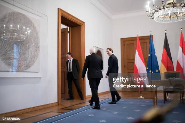 German president Frank-Walter Steinmeier and Austrian chancellor Sebastian Kurz leave the room after Kurz signed the golden book at Bellevue Palace...