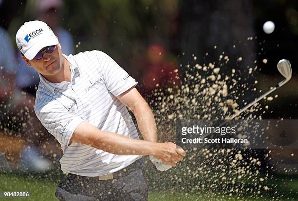 Zach Johnson hits a bunker shot on the seventh hole during the first round of the Verizon Heritage at the Harbour Town Golf Links on April 15, 2010...