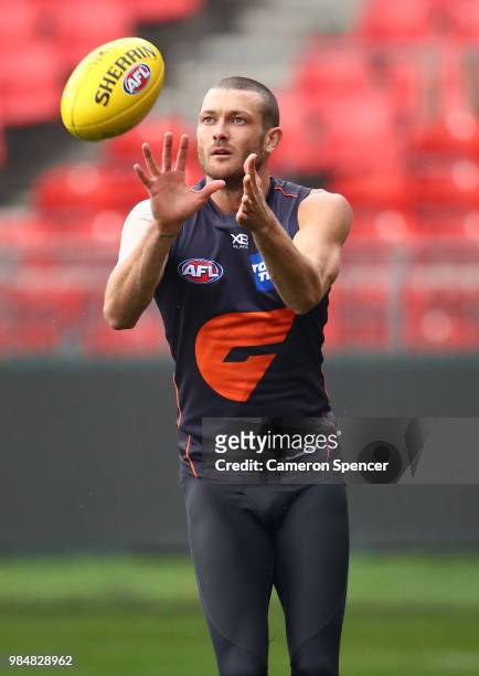 Sam Reid of the Giants catches the ball during a Greater Western Sydney Giants AFL training session at Spotless Stadium on June 27, 2018 in Sydney,...