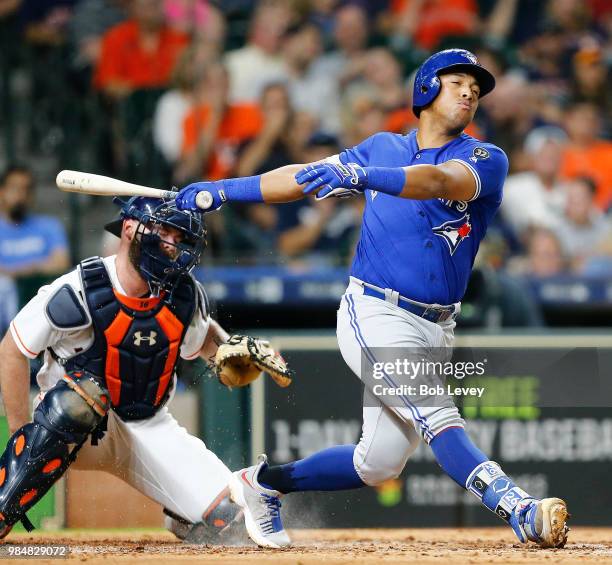 Yangervis Solarte of the Toronto Blue Jays hits Brian McCann of the Houston Astros in the helmet with this backswing at Minute Maid Park on June 26,...