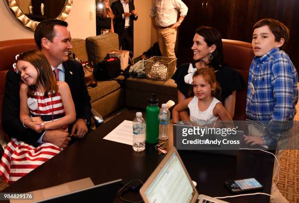 Colorado republican gubernatorial candidate Walker Stapleton, second from left, holds his daughter, Colette Walker left, as his wife Jenna, daughter,...