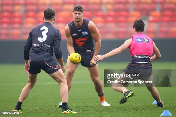 Jonathon Patton of the Giants handpasses during a Greater Western Sydney Giants AFL training session at Spotless Stadium on June 27, 2018 in Sydney,...