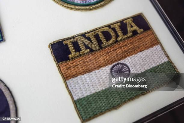 Framed collection of former cosmonaut Rakesh Sharma's mission badges sit on a table in Coonoor, Tamil Nadu, India, on Thursday, June 7, 2018. Sharma,...