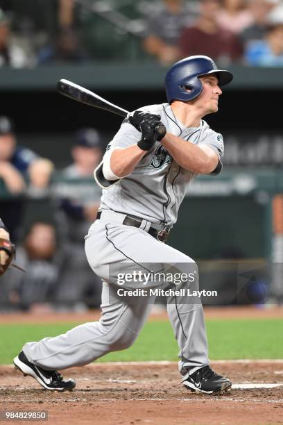 Kyle Seager of the Seattle Mariners singles in two runs in the eighth inning during a baseball game against the Baltimore Orioles at Oriole Park at...