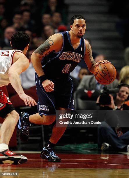 Deron Williams of the Utah Jazz moves up court against Kirk Hinrich of the Chicago Bulls at the United Center on March 9, 2010 in Chicago, Illinois....