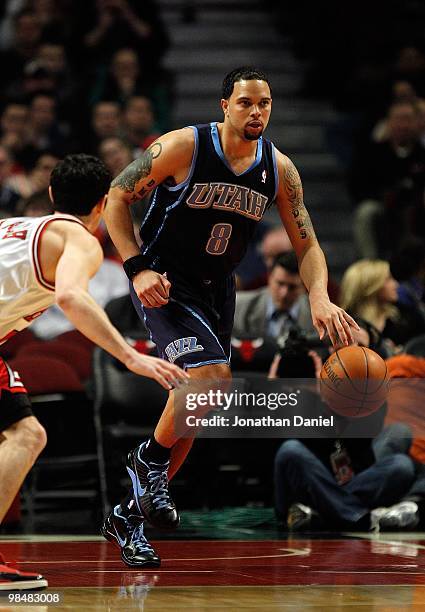 Deron Williams of the Utah Jazz moves up court against Kirk Hinrich of the Chicago Bulls at the United Center on March 9, 2010 in Chicago, Illinois....