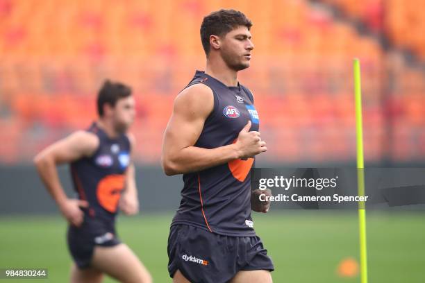 Jonathon Patton of the Giants warms up during a Greater Western Sydney Giants AFL training session at Spotless Stadium on June 27, 2018 in Sydney,...