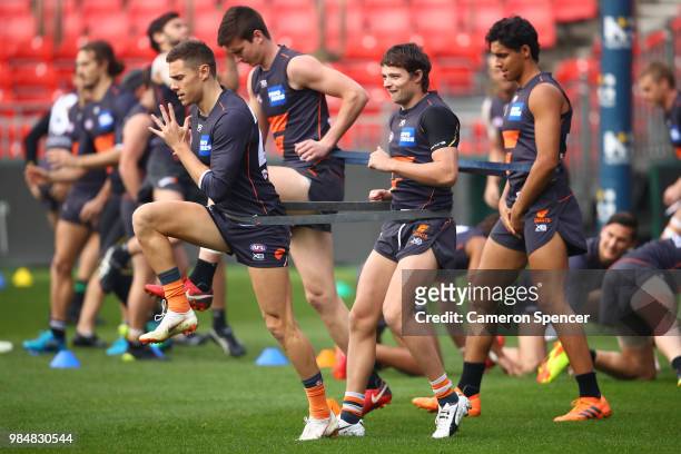 Josh Kelly of the Giants warms up during a Greater Western Sydney Giants AFL training session at Spotless Stadium on June 27, 2018 in Sydney,...