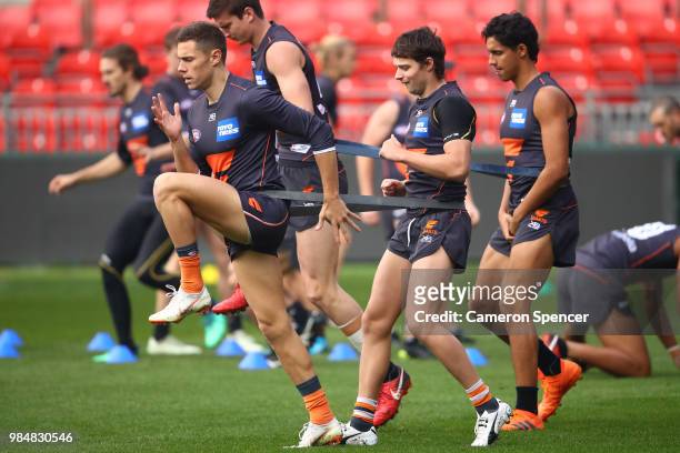 Josh Kelly of the Giants warms up during a Greater Western Sydney Giants AFL training session at Spotless Stadium on June 27, 2018 in Sydney,...