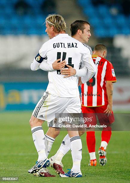 Rafael Van der Vaart of Real Madrid is congratulated by Guti after scoring Real's second goal during the La Liga match between UD Almeria and Real...