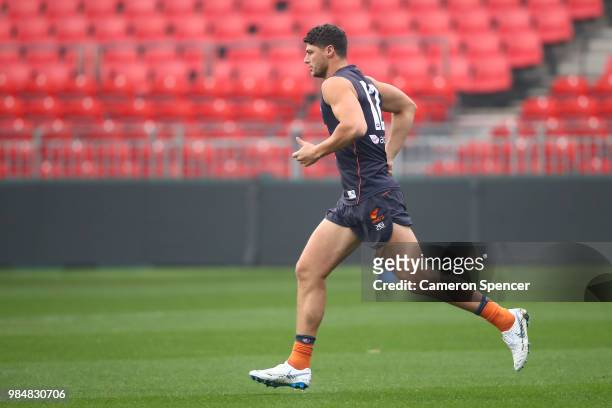 Jonathon Patton of the Giants warms up during a Greater Western Sydney Giants AFL training session at Spotless Stadium on June 27, 2018 in Sydney,...
