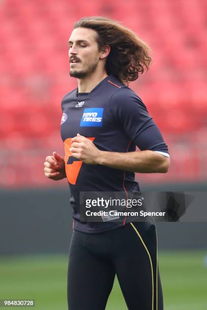 Phil Davis of the Giants warms up during a Greater Western Sydney Giants AFL training session at Spotless Stadium on June 27, 2018 in Sydney,...