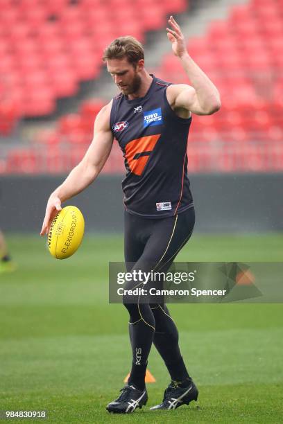 Dawson Simpson of the Giants kicks during a Greater Western Sydney Giants AFL training session at Spotless Stadium on June 27, 2018 in Sydney,...