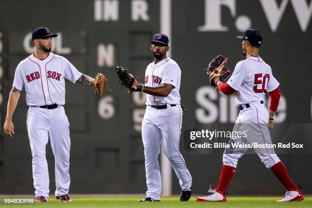 Blake Swihart, Jackie Bradley Jr. #19, and Mookie Betts of the Boston Red Sox celebrate a victory against the Los Angeles Angels of Anaheim on June...
