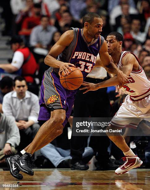 Grant Hill of the Phoenix Suns drives against Jannero Pargo of the Chicago Bulls at the United Center on March 30, 2010 in Chicago, Illinois. The...