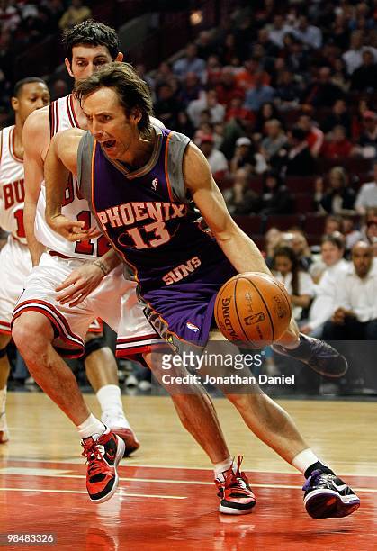 Steve Nash of the Phoenix Suns drives around Kirk Hinrich of the Chicago Bulls at the United Center on March 30, 2010 in Chicago, Illinois. The Suns...