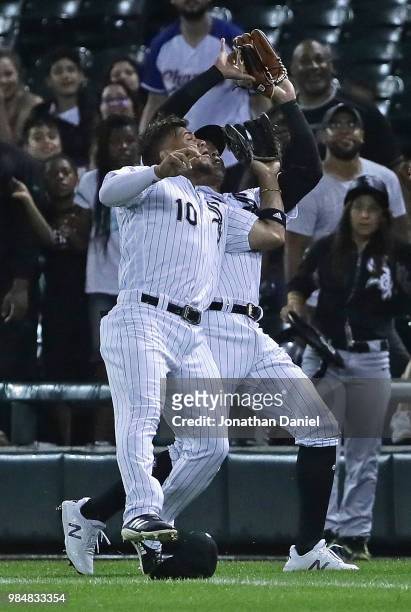 Yoan Moncada and Avisail Garcia of the Chicago White Sox collide in foul territory going for the ball in the 1st inning against the Minnesota Twins...