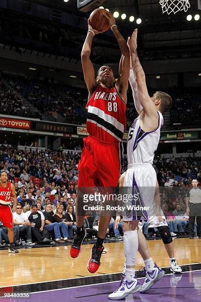 Nicolas Batum of the Portland Trail Blazers goes up for a shot against Andres Nocioni of the Sacramento Kings during the game at Arco Arena on April...