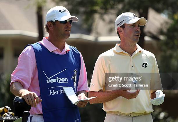 Matt Kuchar waits alongside his caddie Lace Bennett on a tee during the first round of the Verizon Heritage at the Harbour Town Golf Links on April...