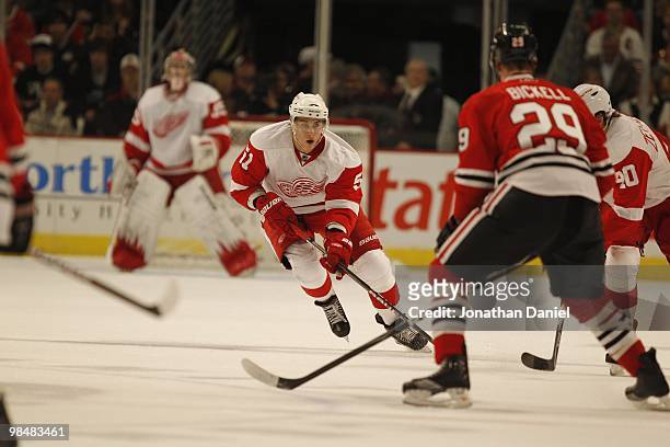 Valtteri Filppula of the Detroit Red Wings skates up the ice against Bryan Bickell of the Chicago Blackhawks at the United Center on April 11, 2010...