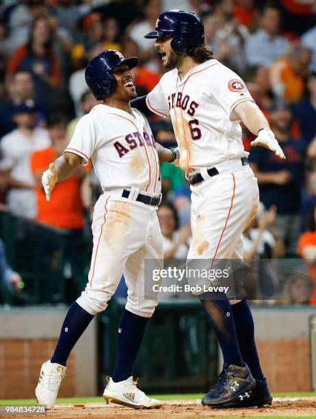 Jake Marisnick of the Houston Astros high fives with Tony Kemp after hitting a three run home run in the eighth inning against the Toronto Blue Jays...